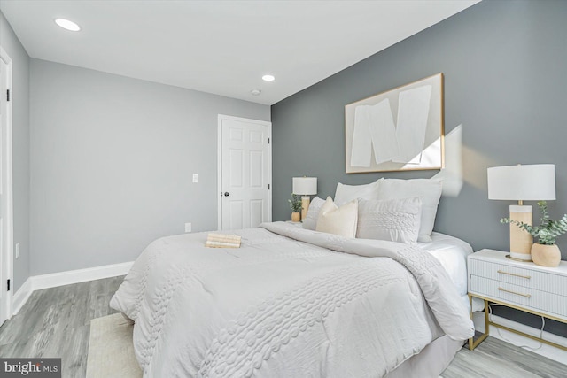 bedroom with light hardwood / wood-style flooring