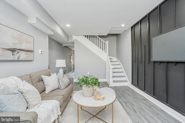 living room with light hardwood / wood-style flooring