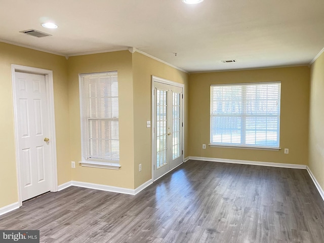 doorway featuring crown molding, wood-type flooring, and french doors