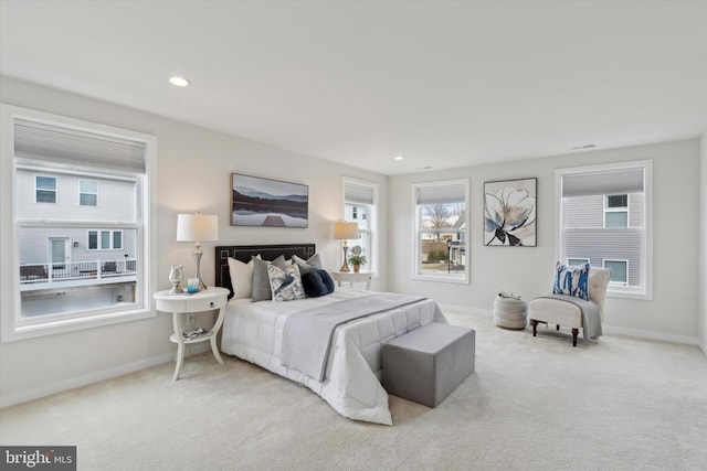 bedroom with light colored carpet