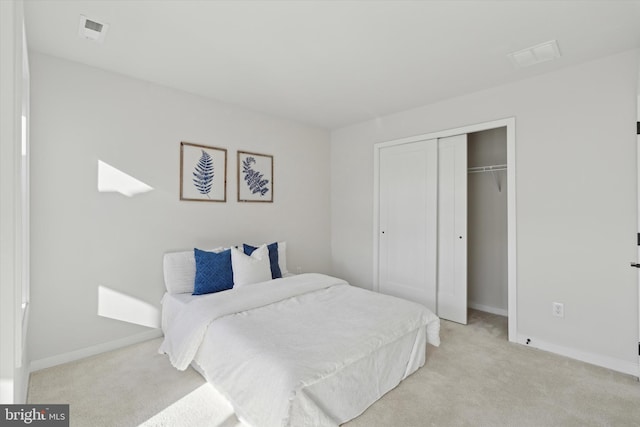 carpeted bedroom featuring a closet