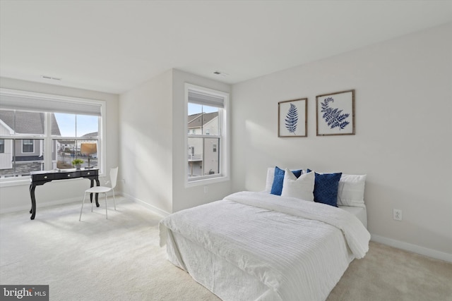 bedroom with light carpet