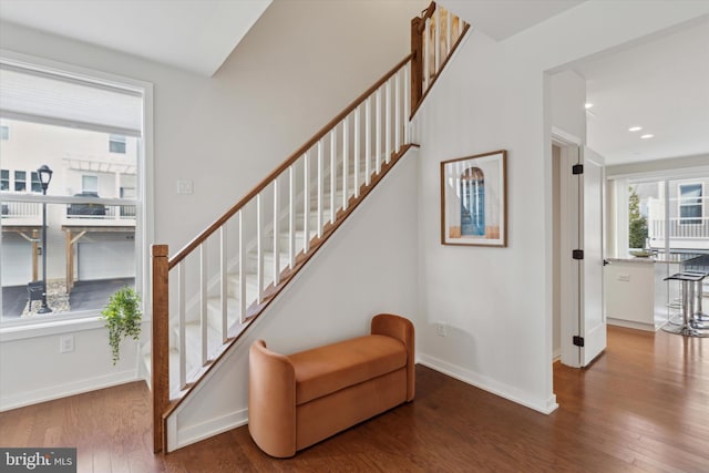 stairway featuring hardwood / wood-style flooring