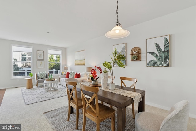 dining room with light carpet