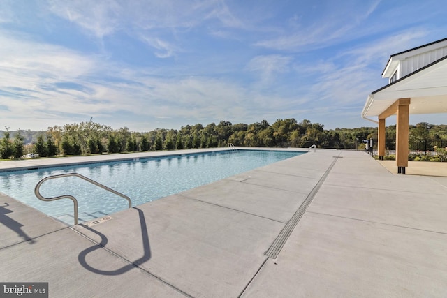 view of swimming pool with a patio area