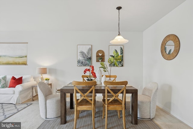 dining area featuring carpet flooring