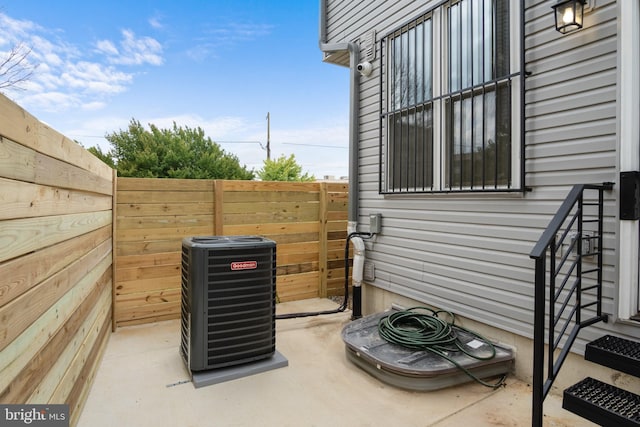 view of property exterior featuring a patio and central AC