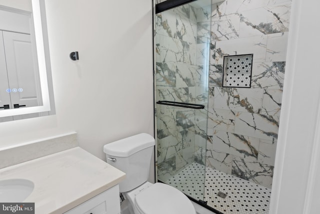 bathroom featuring walk in shower, vanity, and toilet