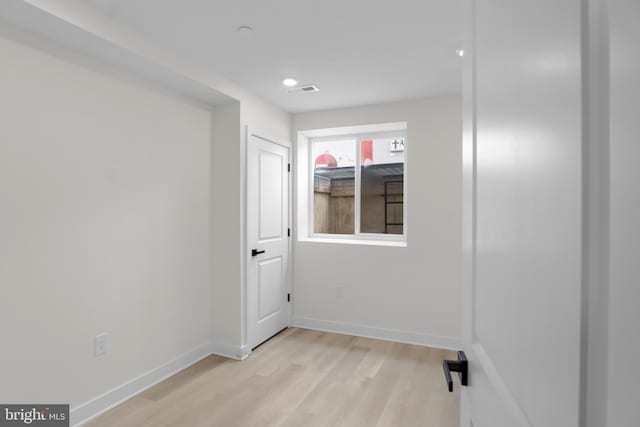 spare room featuring light wood-type flooring