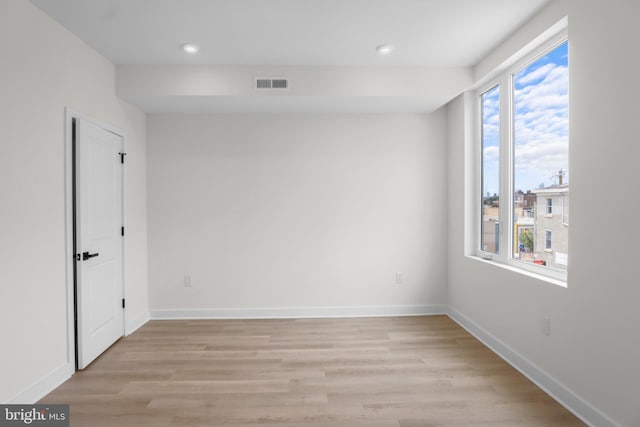 empty room with light hardwood / wood-style floors