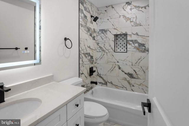 full bathroom with vanity, toilet, and tiled shower / bath combo