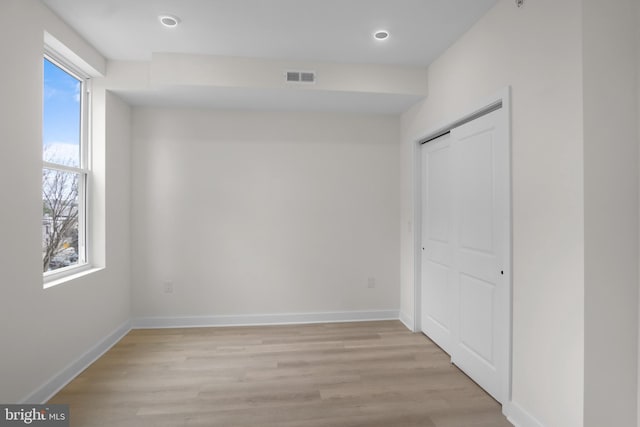 interior space featuring plenty of natural light and light hardwood / wood-style flooring