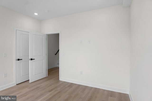 spare room with light hardwood / wood-style floors