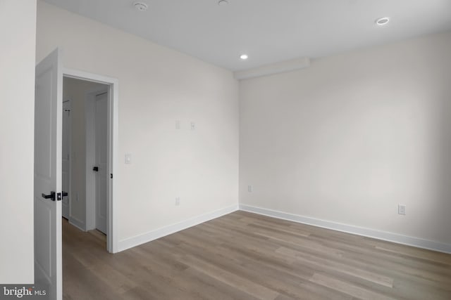 spare room featuring light wood-type flooring