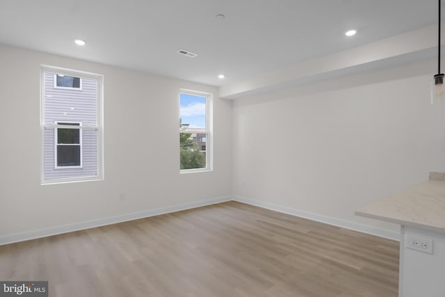 unfurnished room featuring light wood-type flooring