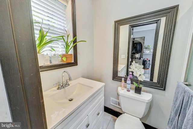 bathroom featuring vanity and toilet