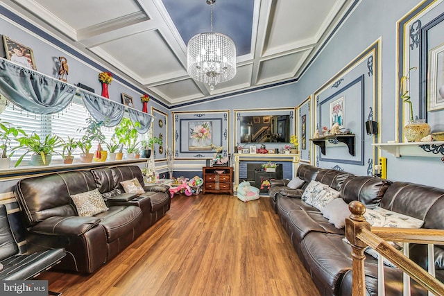 living room featuring an inviting chandelier, hardwood / wood-style floors, a fireplace, and coffered ceiling