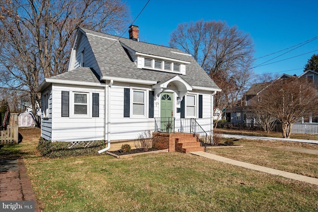 bungalow-style home with a front yard