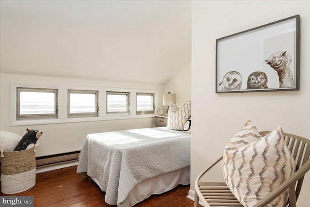 bedroom featuring baseboard heating, lofted ceiling, and dark hardwood / wood-style flooring