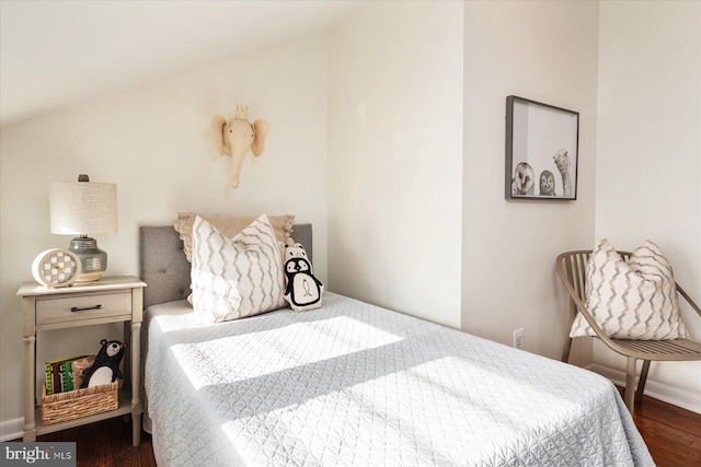 bedroom with dark hardwood / wood-style floors