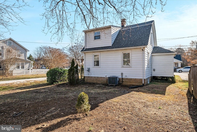 back of property featuring central AC unit