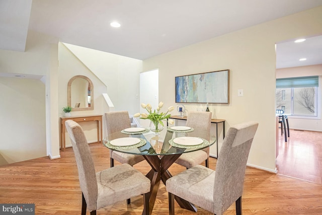 dining space featuring light hardwood / wood-style floors