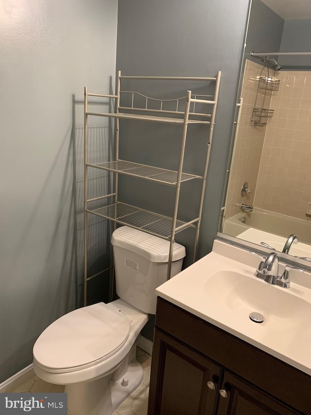 full bathroom with vanity, tiled shower / bath, tile patterned floors, and toilet