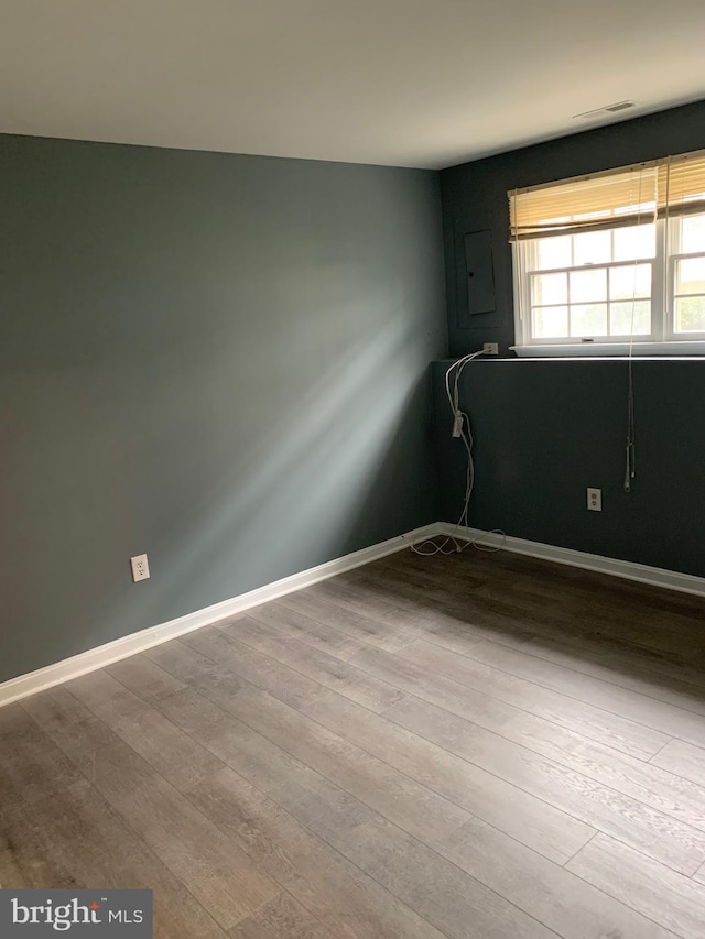 spare room with light hardwood / wood-style flooring