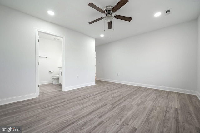 unfurnished bedroom with light hardwood / wood-style flooring, ceiling fan, and ensuite bathroom