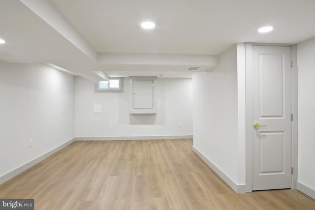 basement featuring light wood-type flooring