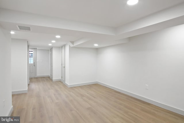 basement with light wood-type flooring