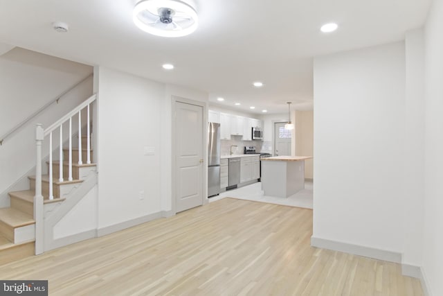 unfurnished living room featuring light hardwood / wood-style flooring