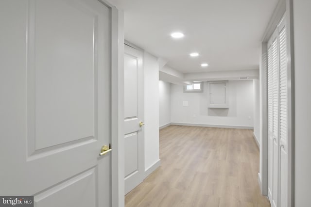 corridor featuring light hardwood / wood-style floors