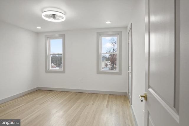 unfurnished room with light hardwood / wood-style flooring