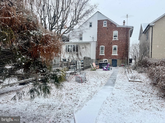 view of snow covered house