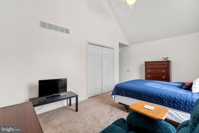 bedroom featuring ceiling fan, light carpet, high vaulted ceiling, and a closet