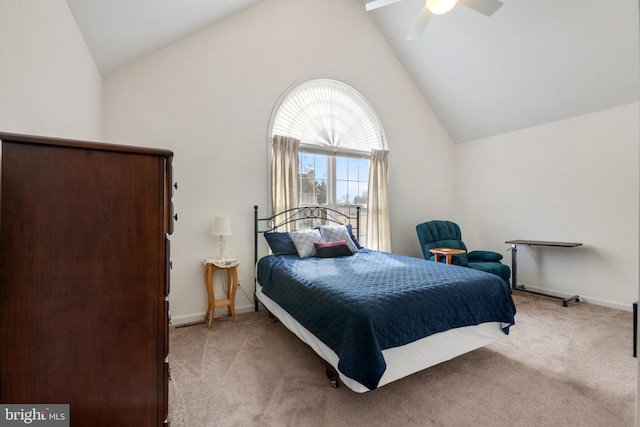 bedroom with high vaulted ceiling and light carpet