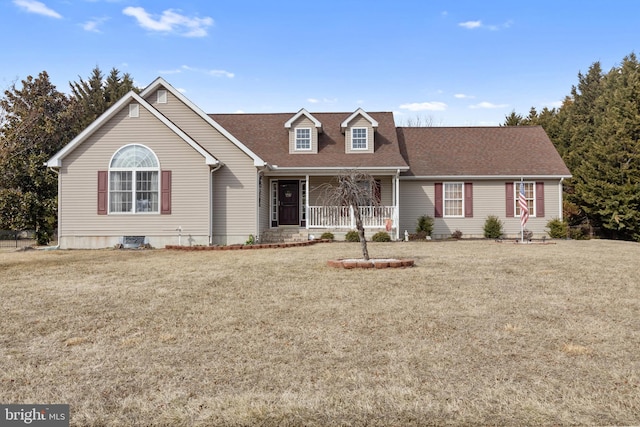 cape cod house featuring a front yard and covered porch