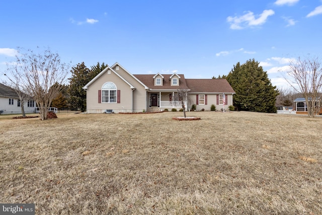 view of front of home with covered porch and a front yard