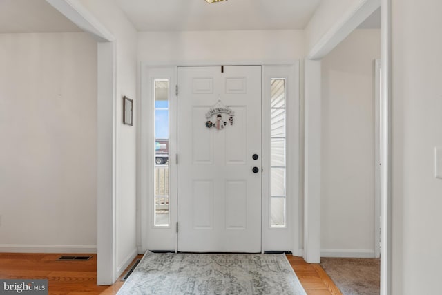 entrance foyer with light hardwood / wood-style floors