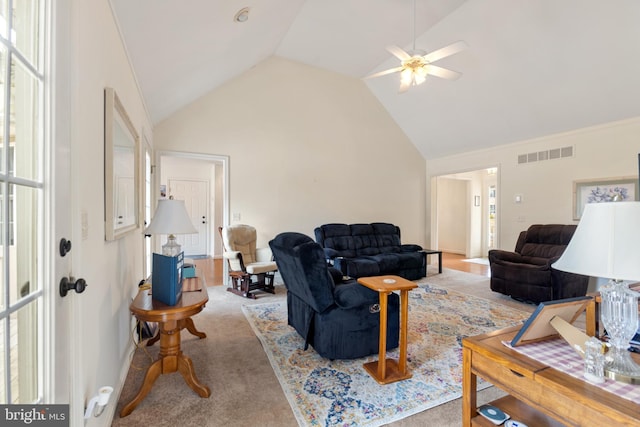 living room with ceiling fan, light colored carpet, and high vaulted ceiling