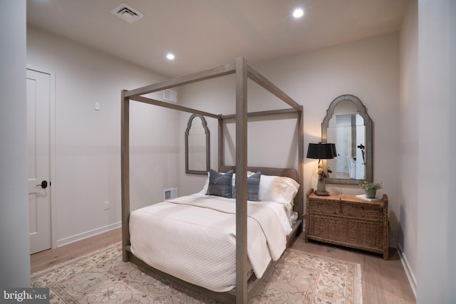 bedroom with light hardwood / wood-style floors