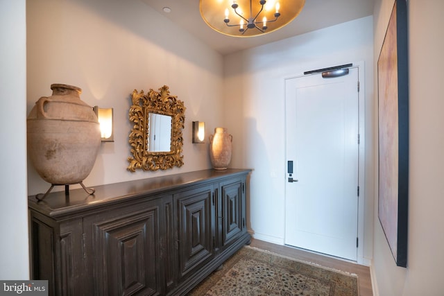 entryway with an inviting chandelier