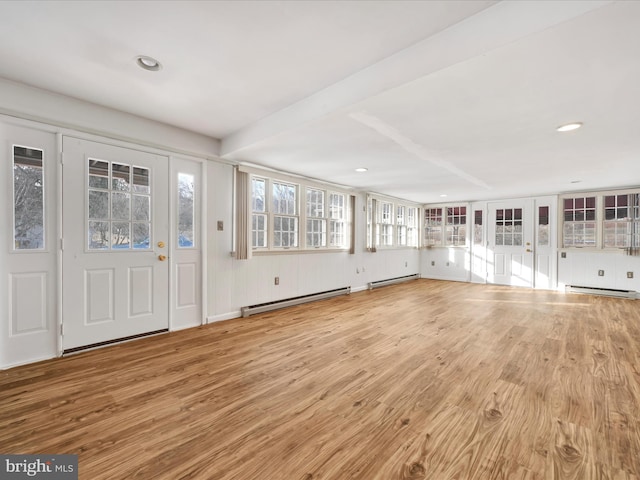 foyer entrance with beam ceiling, a baseboard heating unit, and light wood-type flooring