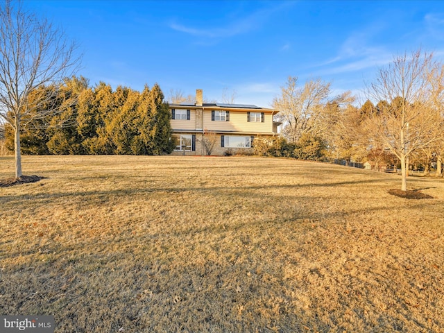 exterior space featuring a front lawn