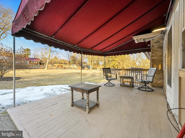 view of snow covered deck