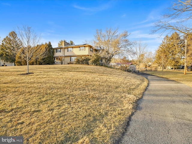 exterior space featuring a front lawn