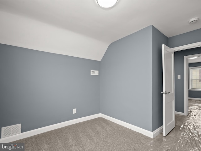 bonus room featuring lofted ceiling and carpet