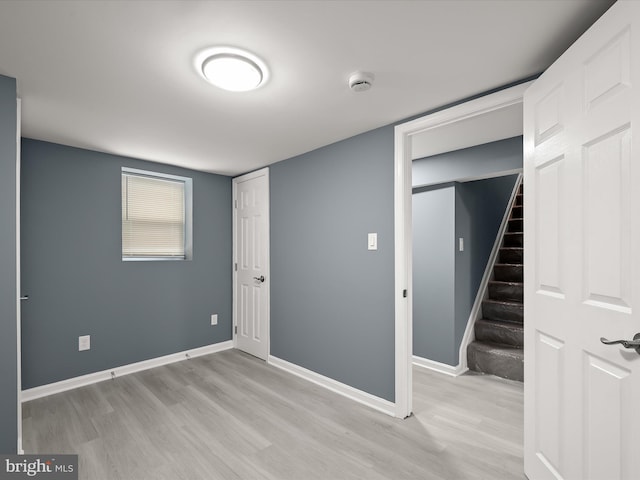 unfurnished bedroom with light wood-type flooring