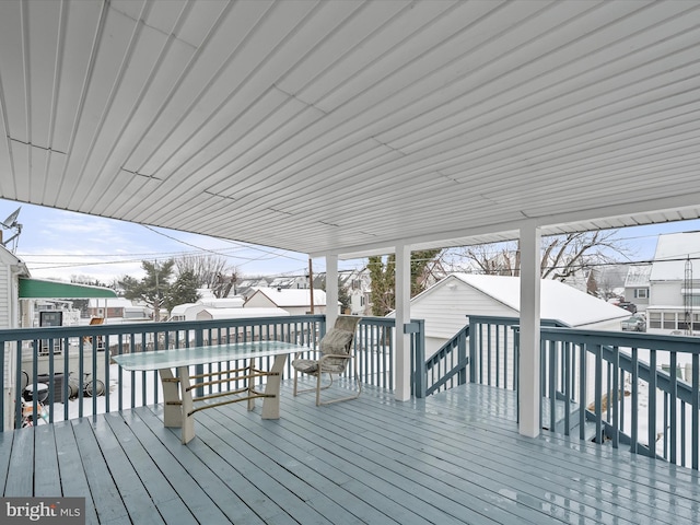 view of snow covered deck